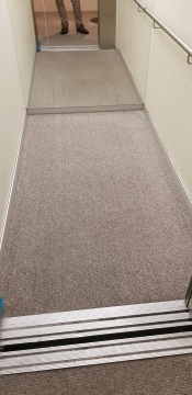 Wool loop carpet in apartment lift - after